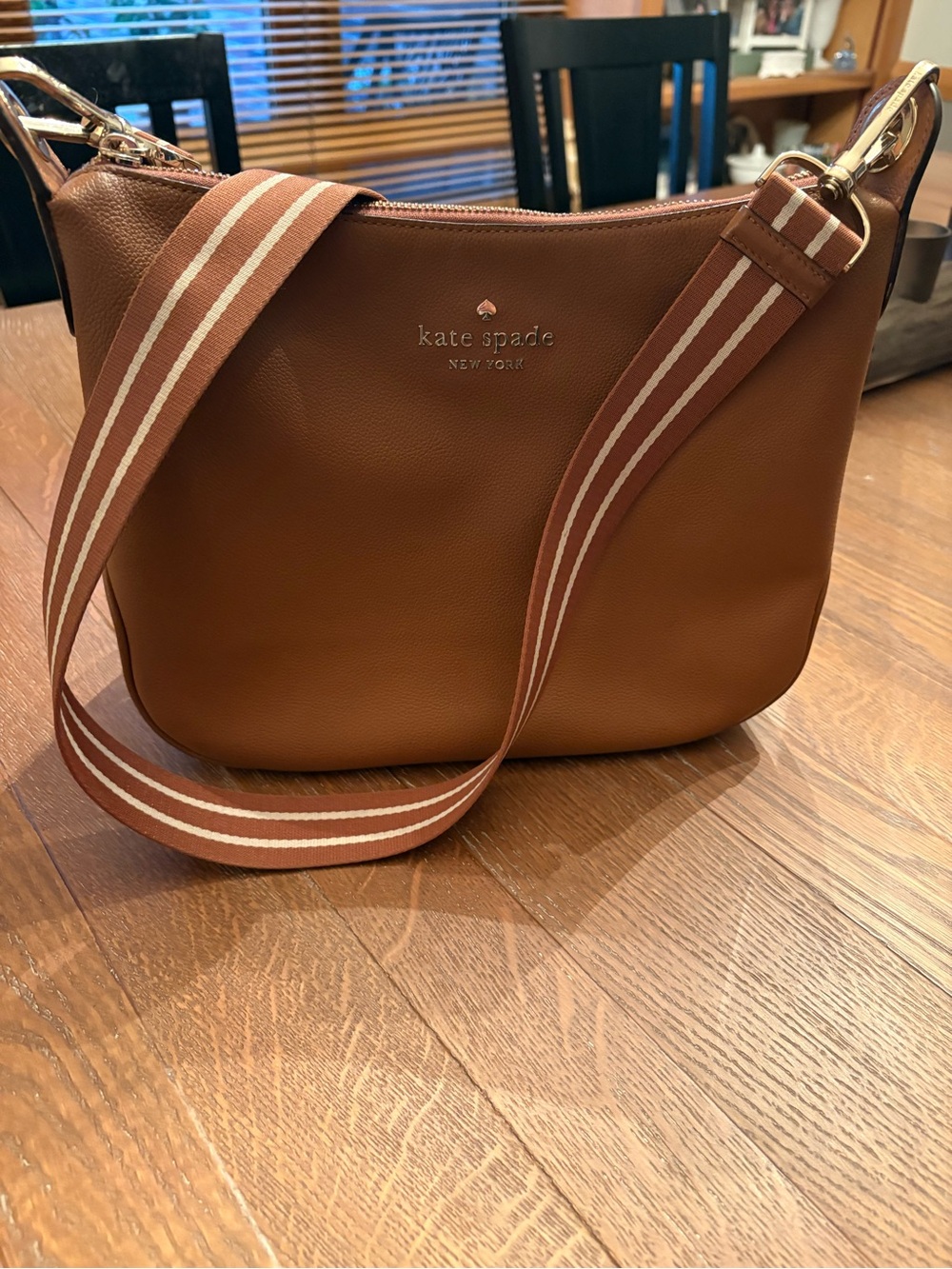 Kate Spade Tan Pebbled Leather Crossbody Bag with long adjustable striped strap